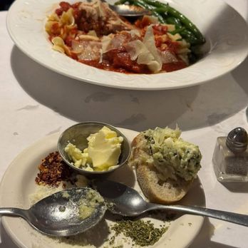 1157 North - All the seasonings for our bread and a spaghetti plate in the background - Seafood Near Me - Elmira, New York 1157 North - All the seasonings for our bread and a spaghetti plate in the background - Seafood Near Me - Elmira, New York