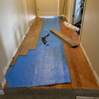 DK Laminate Installation - a hardwood floor being installed - Flooring Near Me