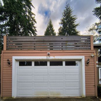 Boulder Peak Restoration - Before: water leak on garage beam causing it to rot. Sagging door - Damage Restoration Near Me - Bellevue, Washington