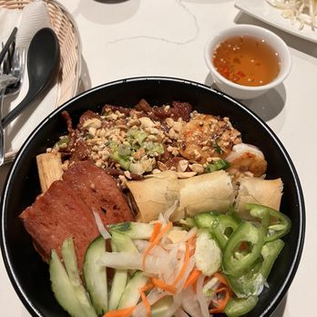 Moms Dishes - Vermicelli Bowl (the special one in the menu with pork and shrimp and something else). One the side is a fish sauce with peppers in it. - Vietnamese Near Me - Yakima, Washington
