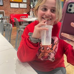 Macy enjoying the ambiance and a shake