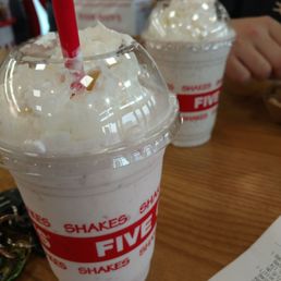 two cups of ice cream with straws two cups of ice cream with straws