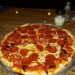 Pepperoni and sun dried tomatoes pizza