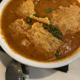 Tomato bisque with crusty Parmesan.