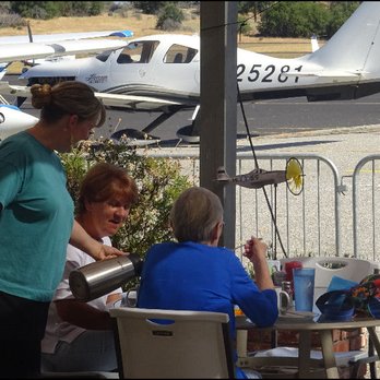 Wings Grill & Espresso Bar - Friendly Casey pours coffee to a couple of diners enjoying the fine weather and view on the patio. - Breakfast & Brunch Near Me - Auburn, California