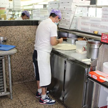 Bedstuy Mike's Pizza - a woman making pizza - Italian Near Me - Brooklyn, New York Bedstuy Mike's Pizza - a woman making pizza - Italian Near Me - Brooklyn, New York