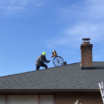 Sewer Inspector - Kyle had to haul his equipment onto the roof. - Home Inspectors Near Me