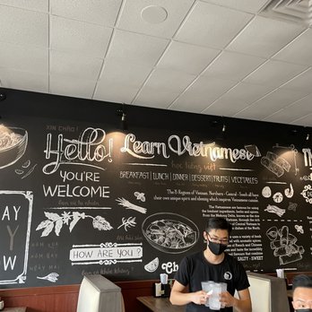 Pho Saigon - two men sitting at a table in a restaurant - Vietnamese Near Me - Katy, Texas Pho Saigon - two men sitting at a table in a restaurant - Vietnamese Near Me - Katy, Texas