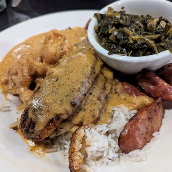 Urban Bar & Kitchen - CREOLE SURF & TURF: Blackened grouper & conecuh sausage, over white rice, and topped with shrimp creole and a side of collard greens. - American Near Me - Tuscaloosa, Alabama Urban Bar & Kitchen - CREOLE SURF & TURF: Blackened grouper & conecuh sausage, over white rice, and topped with shrimp creole and a side of collard greens. - American Near Me - Tuscaloosa, Alabama