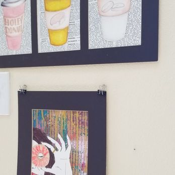 Holey Donuts - three different types of donuts hanging on a wall - Desserts Near Me - Denton, Texas