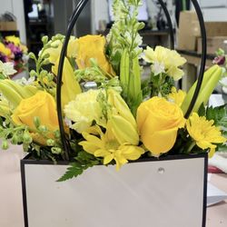 Leaning Lily - Floral arrangement in a "pocketbook"!