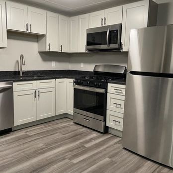 Mister Granite - kitchen with stainless steel appliances - Countertop Installation Near Me - Newton, Massachusetts