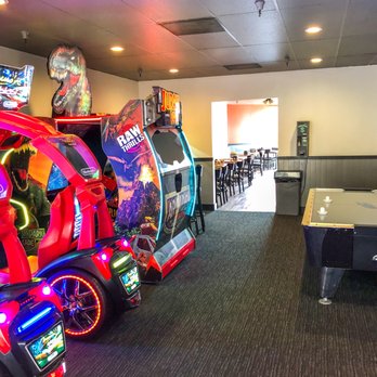 Round Table Pizza - Large game room and adjacent dining room - Pizza Near Me - Half Moon Bay, California Round Table Pizza - Large game room and adjacent dining room - Pizza Near Me - Half Moon Bay, California