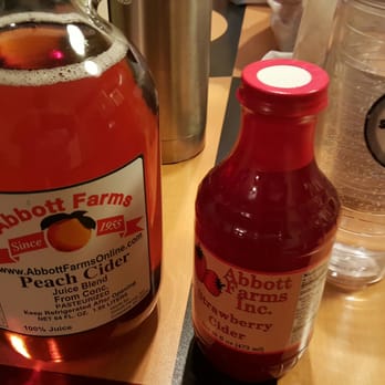Abbott Farms - a bottle of peach cid next to a bottle of peach cid - Grocery Near Me - Cowpens, South Carolina