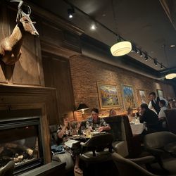 J.W. Heist Steakhouse - Interior shot from our table. Western art & gorgeous decor
