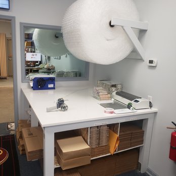 Postal Plus - Packing Table - Shipping Centers Near Me - Gainesville, Virginia