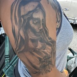 Redwood Tattoo Co - Harsh black line on her cheek which looks cringy all together. Harsh lines and some are barely visible and mixed ink