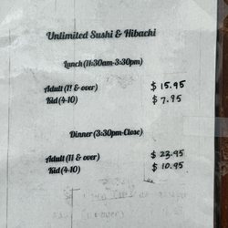 Makino Japanese Buffet - Lunch and Dinner prices taped to the front door.