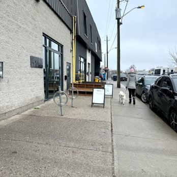 Subtext Coffee Roasters - a man walking his dog - Coffee Roasteries Near Me - Toronto, Ontario