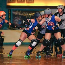 Dominion Derby Girls - DDG's Seven City Sirens, in blue, hitting hard against Mother State Roller Derby