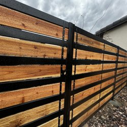 Mendoza Fence - Custom steel & cedar fence with integrated gate.