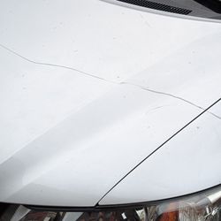Premiere Collision Center - Before (dented and paint scraped)