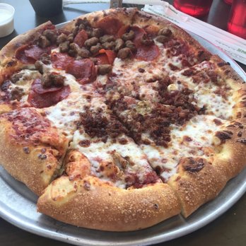 Zax Restaurant - Large pizza- 1/2 extra-cheese & roasted garlic bacon and 1/2 sausage & pepperoni - Pizza Near Me - Moab, Utah Zax Restaurant - Large pizza- 1/2 extra-cheese & roasted garlic bacon and 1/2 sausage & pepperoni - Pizza Near Me - Moab, Utah