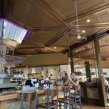 FlatIron Kitchen & Taphouse - Bar area and open kitchen behind. - New American Near Me - Davidson, North Carolina