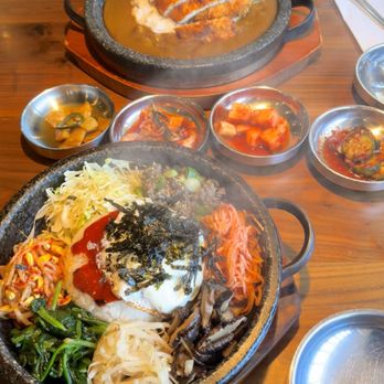 Jin Cook - Hot stone Bulgogi bibimbap (front) Pork/chicken katsu curry with rice (back) Only 4 side dishes :( - Korean Near Me - Buena Park, California Jin Cook - Hot stone Bulgogi bibimbap (front) Pork/chicken katsu curry with rice (back) Only 4 side dishes :( - Korean Near Me - Buena Park, California