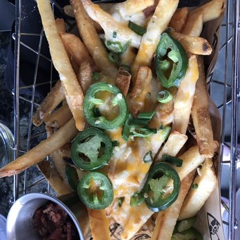Topgolf - Cheese fries, bacon on the side per our request (craft beer queso was lacking in our second order of these but they were still delish). - New American Near Me - Edison, New Jersey Topgolf - Cheese fries, bacon on the side per our request (craft beer queso was lacking in our second order of these but they were still delish). - New American Near Me - Edison, New Jersey
