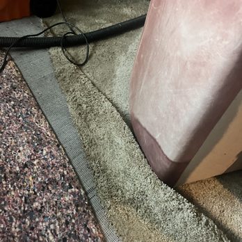 Promontory Point Apartments - Soaking carpet rolled up onto leather couch by maintenance. - Apartments Near Me - Sandy, Utah