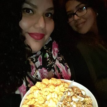 AMC Orange 30 - Munching before the movie starts on some gourmet popcorn  (half caramel half cheese popcorn) - Cinema Near Me - Orange, California