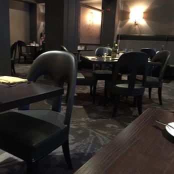 Jardenea - a dining room with tables and chairs - New American Near Me - Washington, DC, District of Columbia