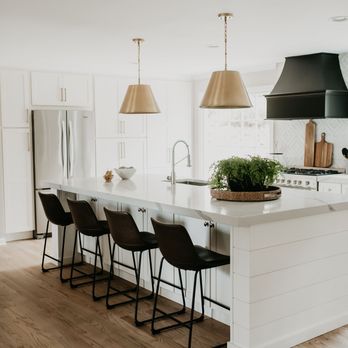 Turner Blair Services - a white kitchen with a large island - General Contractors Near Me Turner Blair Services - a white kitchen with a large island - General Contractors Near Me