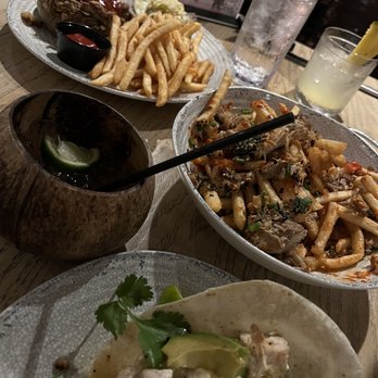The Crooked Surf - Kalua Pork Sandwich, Hurricane Fries, and Peruvian Fish Tacos. Drinks: Pina Clearada and Lime in the Coconut. - Cocktail Bars Near Me - Kapaa, Hawaii The Crooked Surf - Kalua Pork Sandwich, Hurricane Fries, and Peruvian Fish Tacos. Drinks: Pina Clearada and Lime in the Coconut. - Cocktail Bars Near Me - Kapaa, Hawaii
