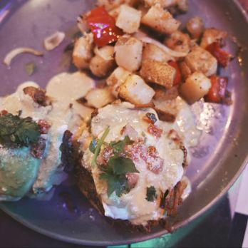 Tempo Cantina - Pork Belly Benedict. Pork belly with chile verde hollandaise sauce gave this dish smoky, salty, and tangy richness. - New American Near Me - Brea, California