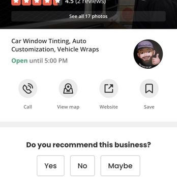 AbelTints - A man wearing a black cap and shirt is applying tint or working on a vehicle at AbelTints, a car customization business in Snellville, GA. - Car Window Tinting Near Me - Snellville, Georgia