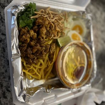 Nine House - a take out container of food - Burmese Near Me - Fort Wayne, Indiana Nine House - a take out container of food - Burmese Near Me - Fort Wayne, Indiana