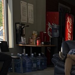 Riverview Tire and Auto Center - Customer lounge area with complimentary coffee, water, and refreshments available while you wait.