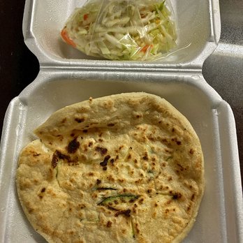 Plaza Latina - Queso & zucchini pupusa, comes with a side of cabbage slaw and salsa roja - Food Court Near Me - Toronto, Ontario Plaza Latina - Queso & zucchini pupusa, comes with a side of cabbage slaw and salsa roja - Food Court Near Me - Toronto, Ontario