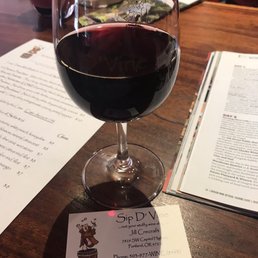glass of wine on a table glass of wine on a table