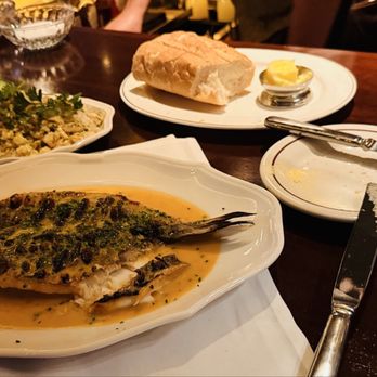 The Driskill Grill - Whole branzino, crab fried rice & glass of Sancerre. - New American Near Me - Austin, Texas