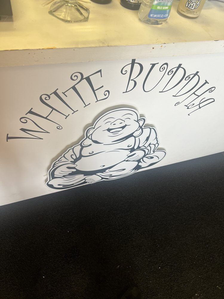 Interior of White Buddha featuring the signature Buddha artwork and cozy dining atmosphere.