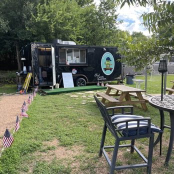 La Tortuga Veloz - a picnic area with tables and chairs - Mexican Near Me - Austin, Texas La Tortuga Veloz - a picnic area with tables and chairs - Mexican Near Me - Austin, Texas