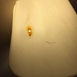 Ivy Rose Motor Inn And Restaurant - Large cigarette burn hole in lamp shade