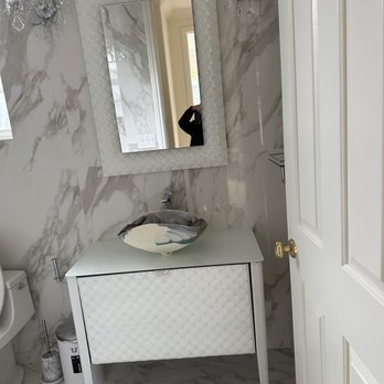 JV Hardwood Floor - a bathroom with a sink and mirror - Flooring Near Me - Oakland, California JV Hardwood Floor - a bathroom with a sink and mirror - Flooring Near Me - Oakland, California