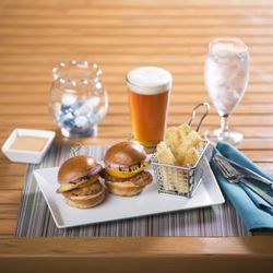 Harry's Poolside Bar & Grill - Little Havana Sliders served on mini sweet island buns featuring roasted pork, grilled onions, and garlic mojo