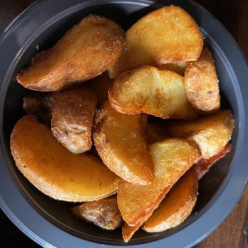 Leaky Cauldron™ - Potato Wedges - British Near Me - Orlando, Florida Leaky Cauldron™ - Potato Wedges - British Near Me - Orlando, Florida