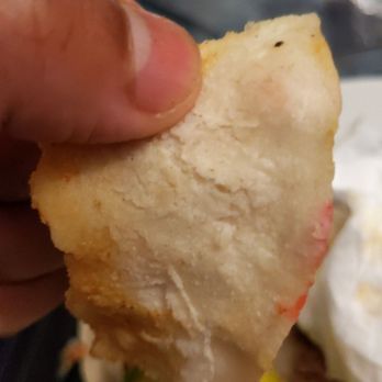 Homemade Taqueria Junction - a hand holding a piece of bread - Mexican Near Me - Corona, New York Homemade Taqueria Junction - a hand holding a piece of bread - Mexican Near Me - Corona, New York