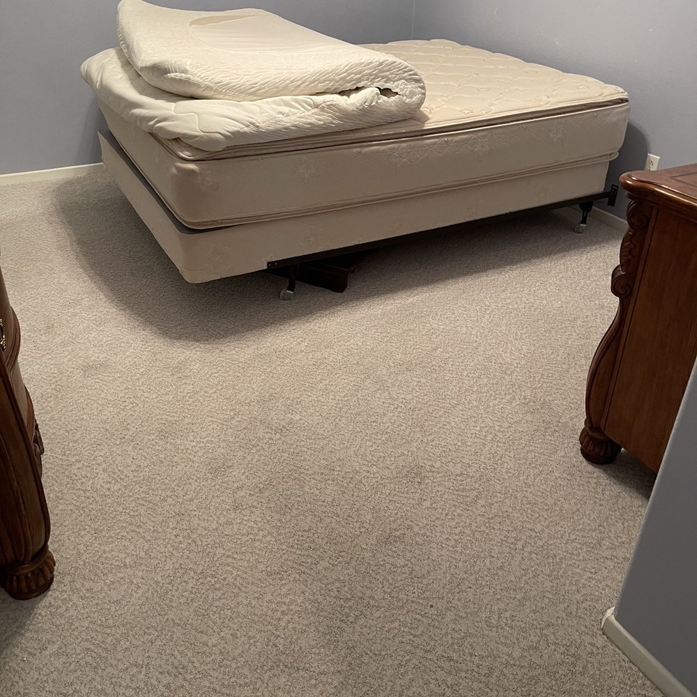 Carpet Time, Inc. - a bed in a bedroom - Carpet Installation Near Me - Riverside, California